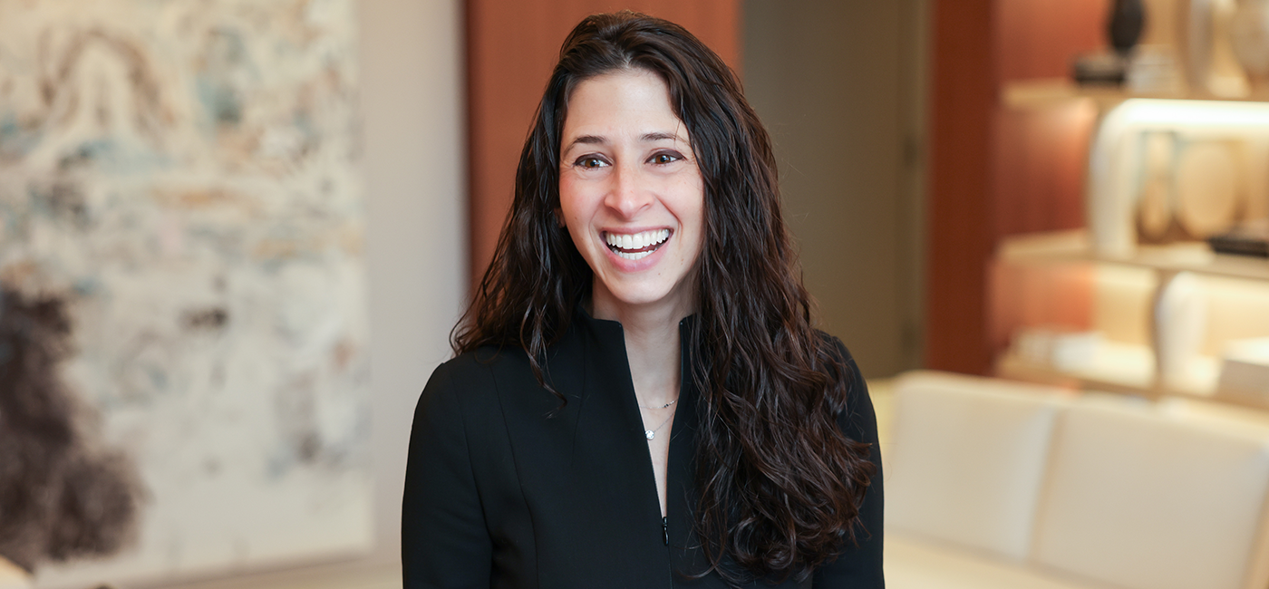 Julie Gamliel smiling at someone in an office
