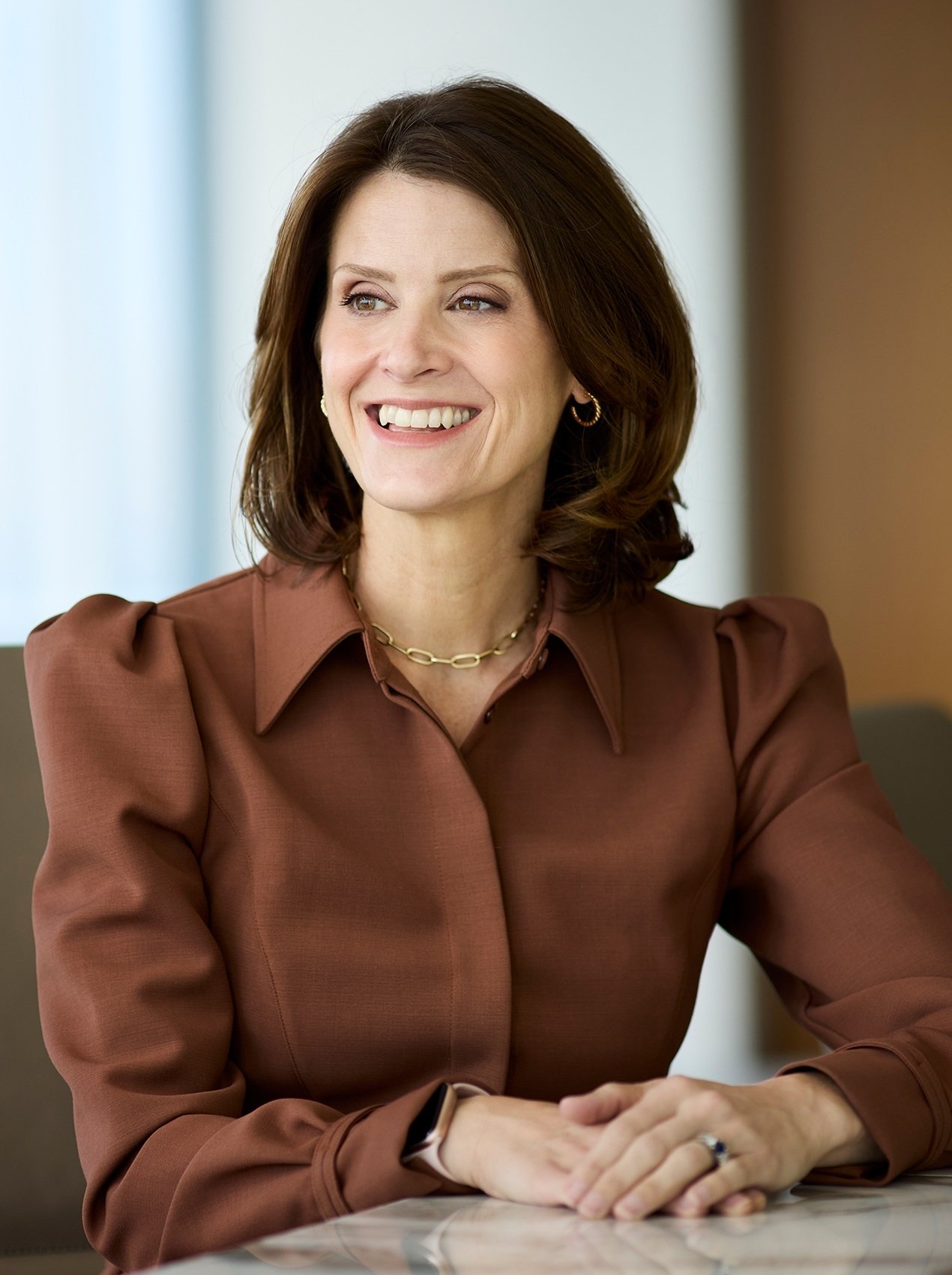 Anna Rotman smiling in conference room