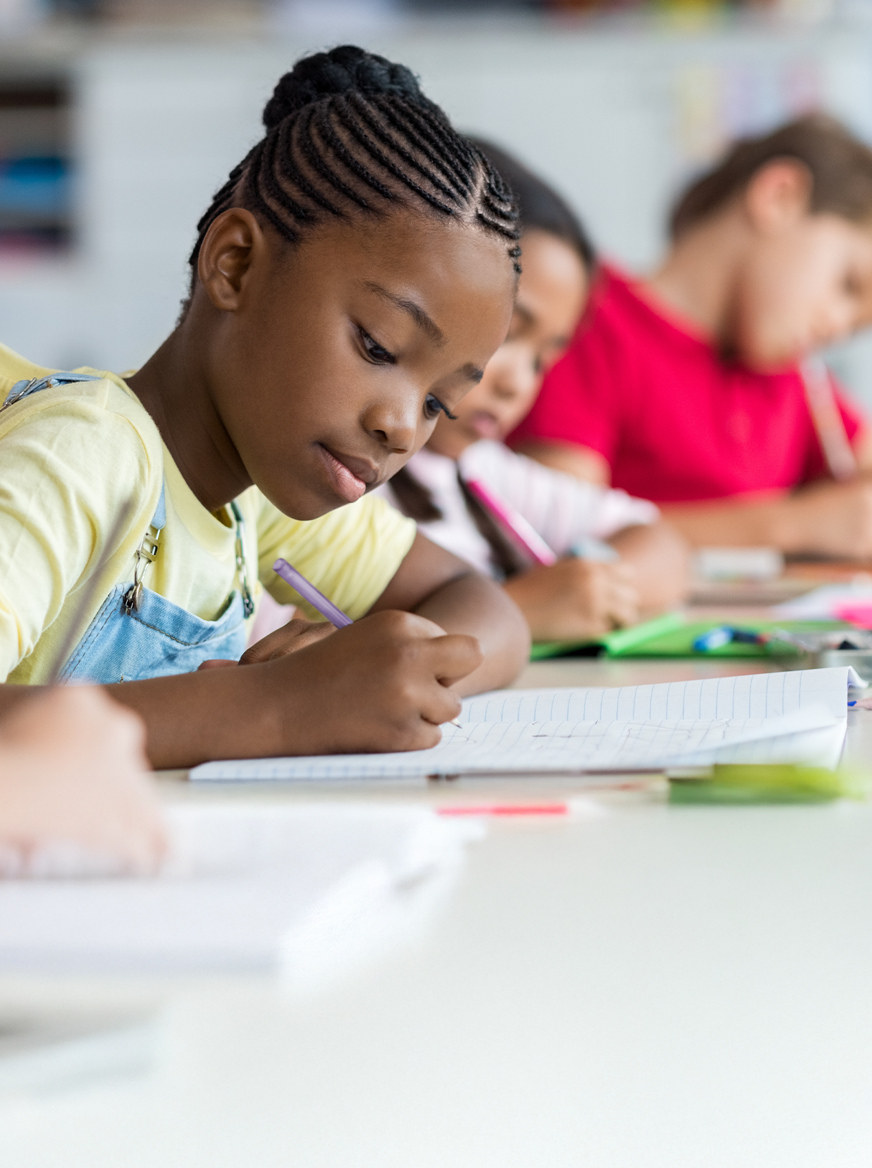 Girl writing on paper