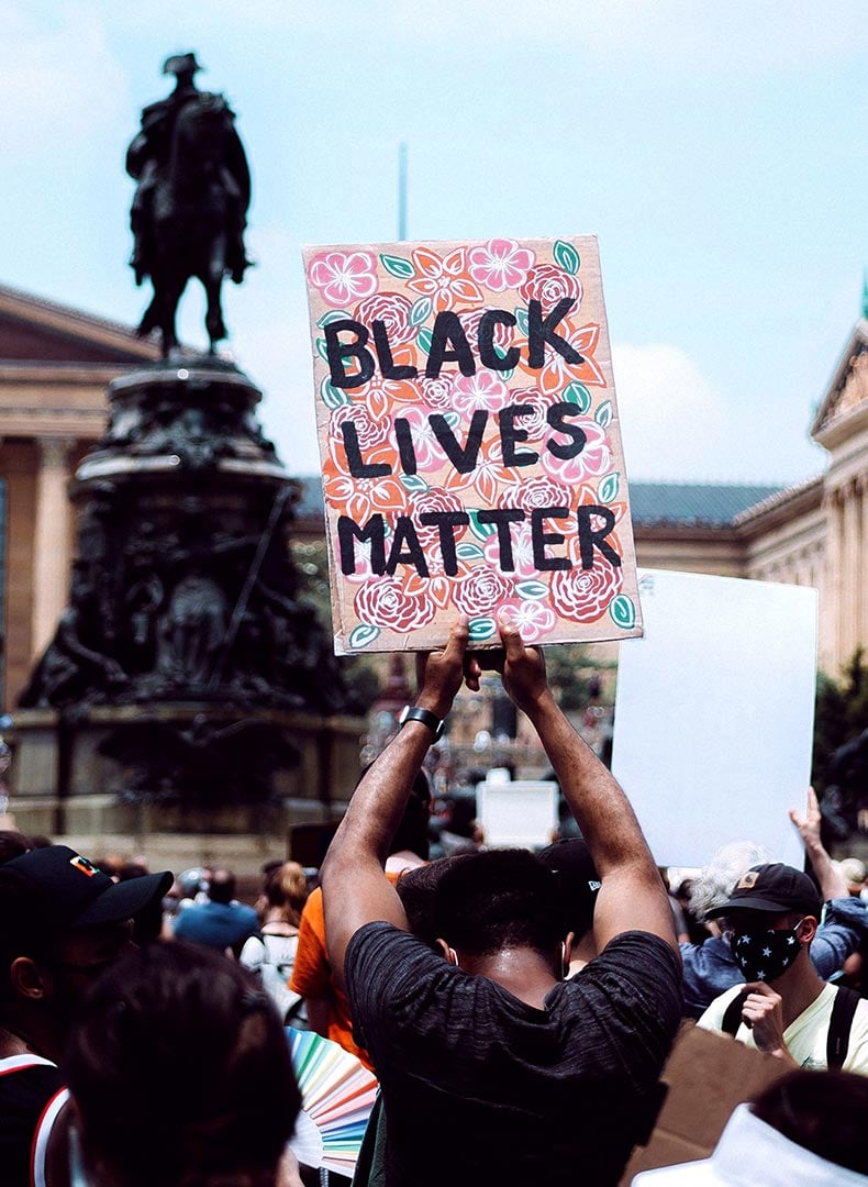 protester holding Black Lives Matter sign